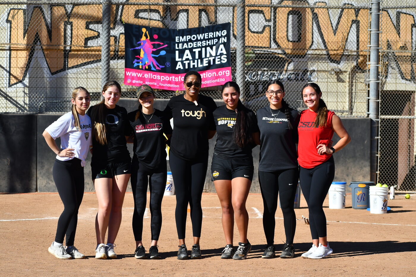 Coach Peters with a group of young women athletes at an Empowering Leadership in Latina Athletes event in West Covina.