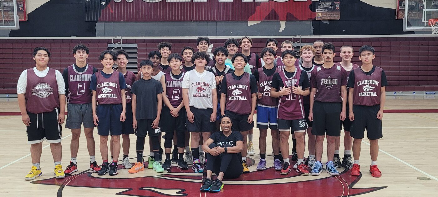 Coach Peters with the Claremont High School boys basketball team on their home court.