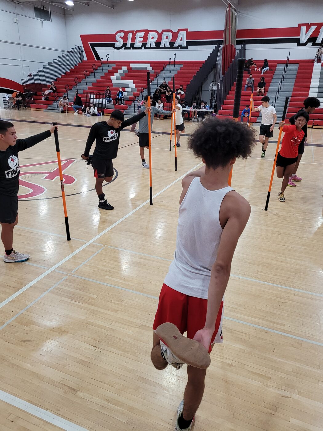 Sierra Vista High School boys basketball athletes during a strength and mobility session.