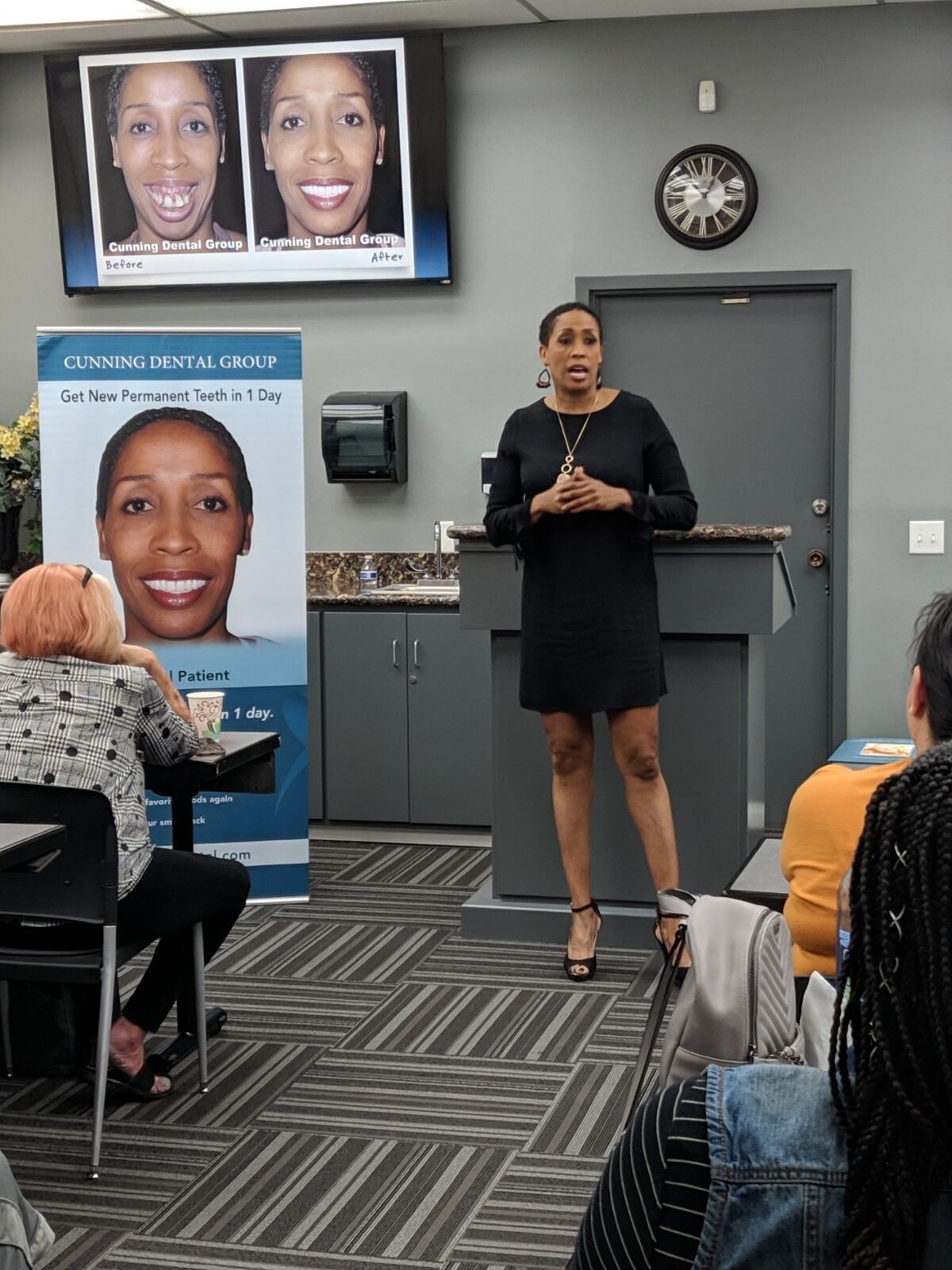Coach Peters speaking at a Cunning Dental Group seminar with before-and-after photos on screen.