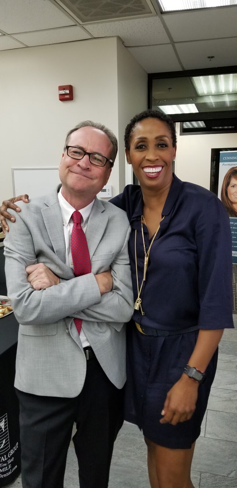 Coach Peters with one of the Cunning Dental Group doctors.