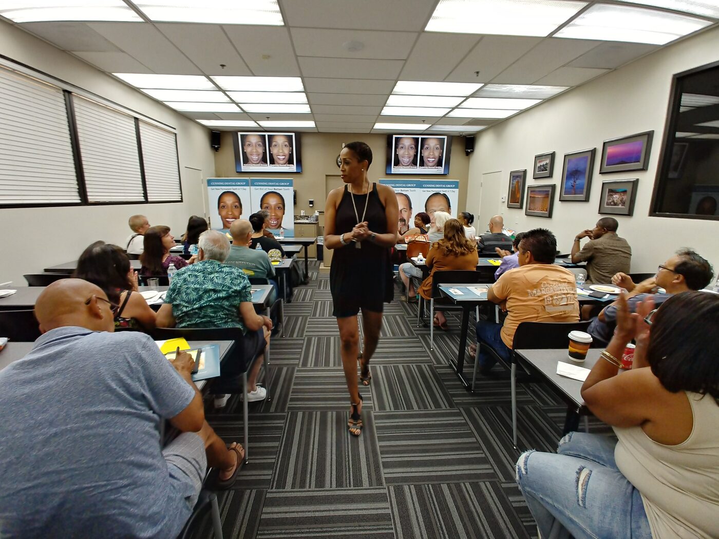Coach Peters presenting to an audience at a Cunning Dental Group seminar.